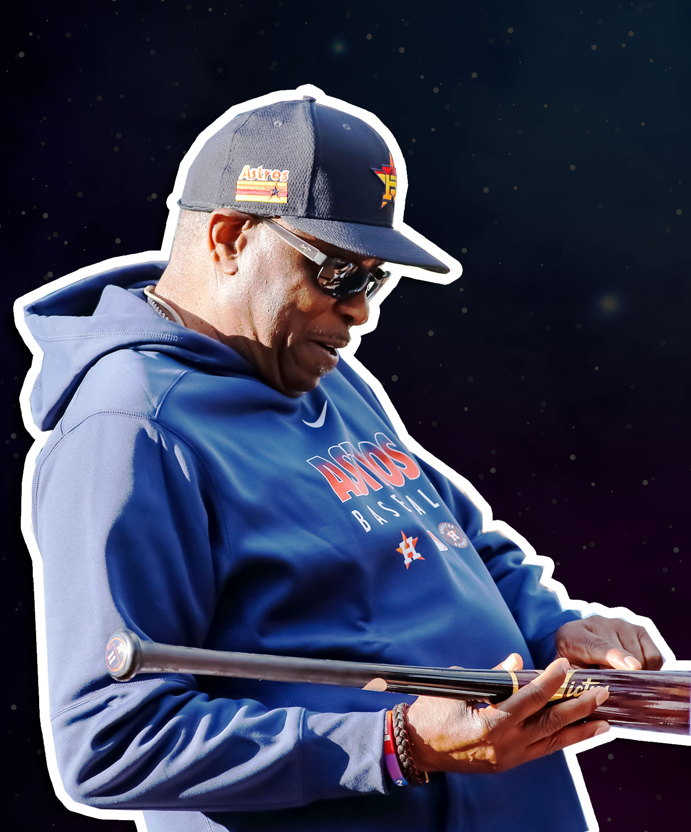dusty baker with baseball bat